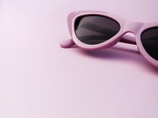 Purple sunglasses and copy space
