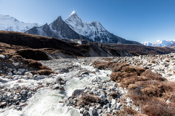 River flowing down the valley while descending from Chukhung to Dingboche, Ama Dablam in the...