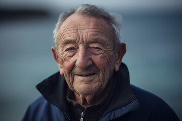 Fototapeta premium Portrait of an old man with grey hair and wrinkled face