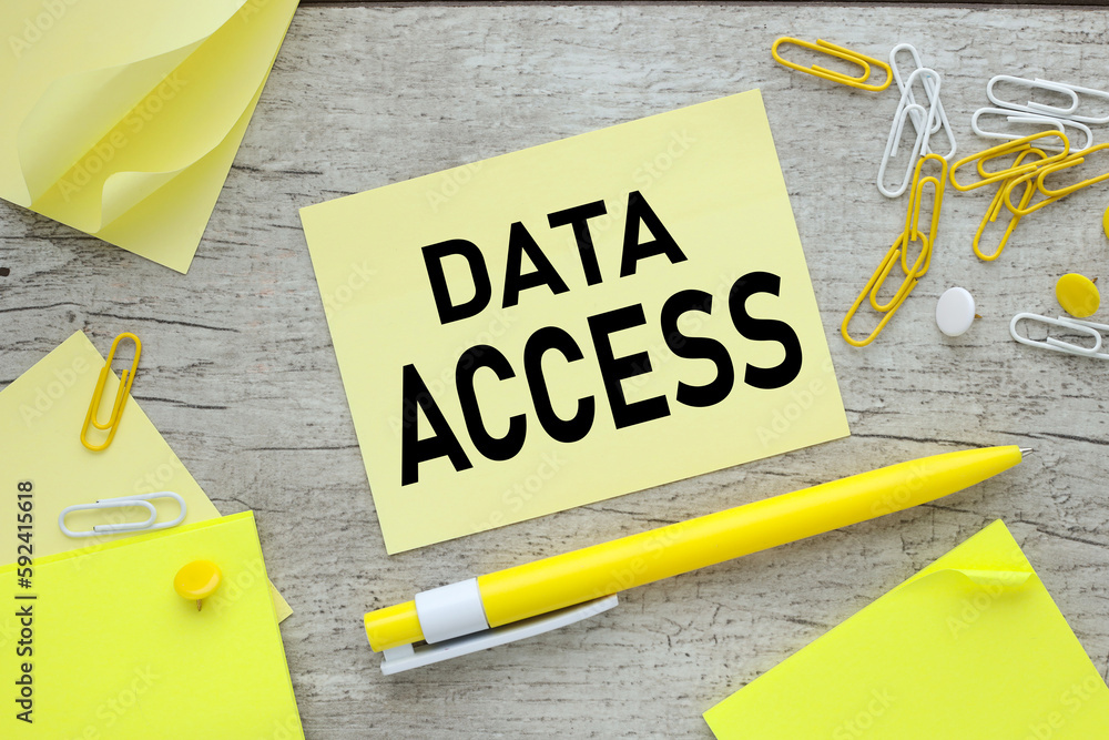 Aufkleber data access - text on a notepad and keyboard. concept of pass or permission to access data.