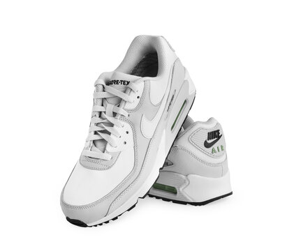 Istanbul, Turkey - April 12, 2023: Nike Air Max 90 GTX model shoes on white background. White and Gray color GORE-TEX shoes. Clipping Path. Isolated.