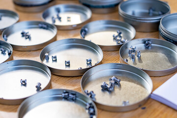 Metal air rifle ammunition in round metal boxes in a shooting competition