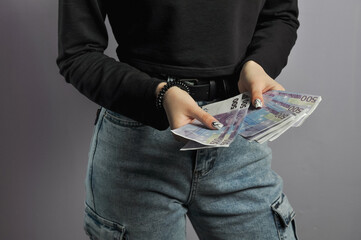 Euro banknotes in the hands of a girl