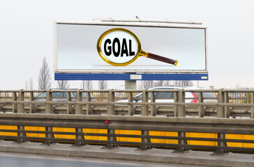 On the highway there is an advertising billboard with the image and the inscription - GOAL