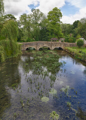 Fototapeta na wymiar Bibury with River Coln, Cotswolds, Gloucestershire, UK