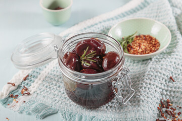 Bowl of pickled plums with spices