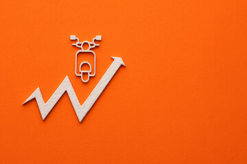 Concept of increasing motorcycle sales - white motorcycle with up arrow on orange color background