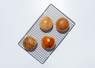 Top view of four freshly baked small breads
