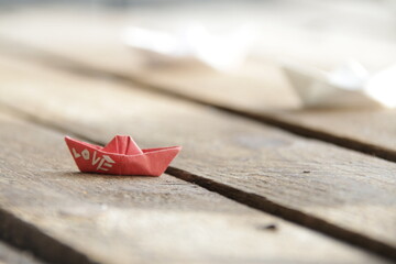 Love concept. Beautiful paper boats on a vintage background.
