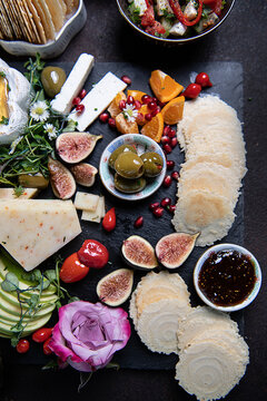 charcuterie board, cheese, figs, tomatoes, olives, apple, honey, orange, dish, raw, plate, fresh, isolated, gourmet, restaurant, cuisine