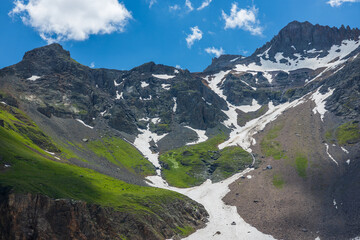 Summer mountains with patches of snow and tundra