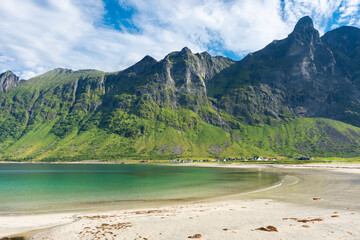 The crystal clear water of the Ersfjordstranda beach in Senja Island,  Norway