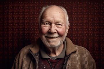 Obraz premium Portrait of a smiling senior man with grey hair and beard.