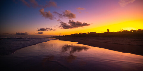 Fototapeta na wymiar Beautiful colorful sunset on wild Patchs beach near Byron Bay. Hiddem gems of NSW, Australia