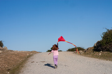 niña con cometa