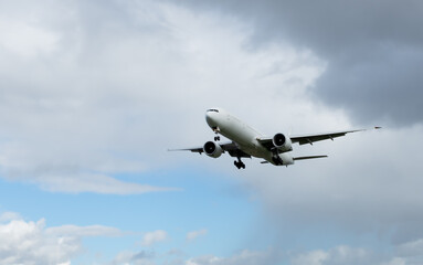Fototapeta na wymiar moving passenger plane in the sky