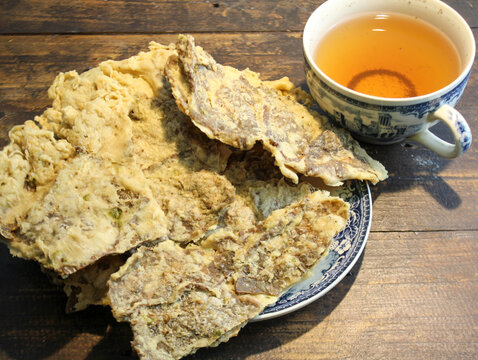 Keripik Paru, a typical Indonesian snack made from beef lung mixed with flour and then fried