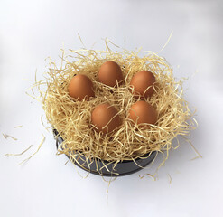 Easter eggs in decorative straw