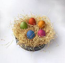 Easter eggs in decorative straw