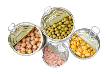 Open tin cans with different products on white background, top view