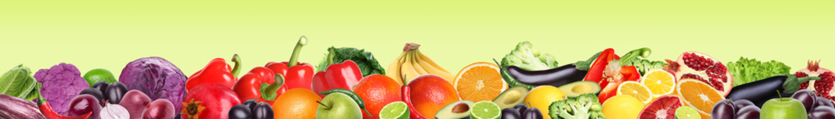 Many different fresh fruits and vegetables on light green background. Banner design