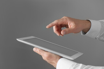 Closeup view of man using new tablet indoors