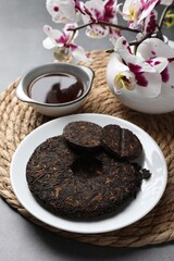 Composition with aromatic pu-erh tea on grey table