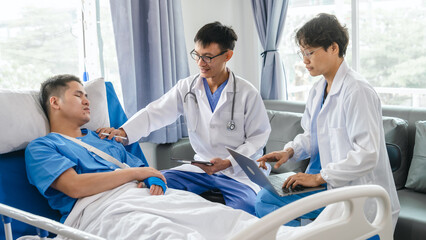 The medical team visits the car accident patients who are lying on the nursing bed and arm cast with wrapping nurse bandages splint to the arm.