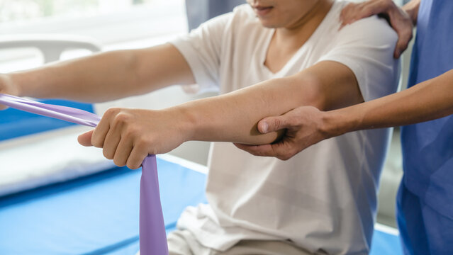 Athlete Undergoing Physiotherapy With A Musculoskeletal Specialist After Sports And Gym Injuries.