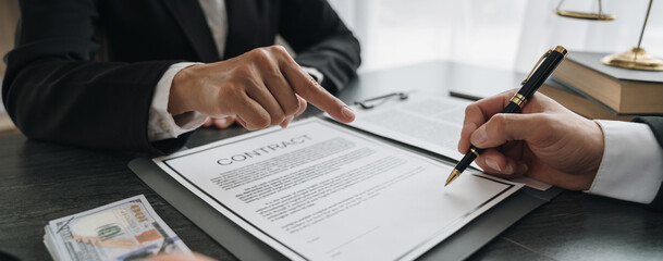 business woman offers bribes to lawyers To help with legal matters in court, bribes corruption illegal fraud bribery concept.