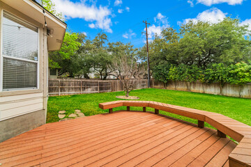 a back yard with a deck patio 