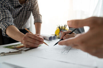 Architects, engineers, contractors working in the office with blueprints, inspection engineers Work analysis for architectural plan, construction project sketch, focus, business construction concept.