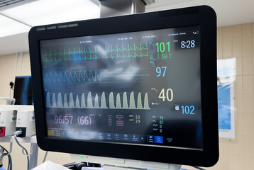 hospital anesthesia machine with attached medical equipment such as blood pressure cuff,...