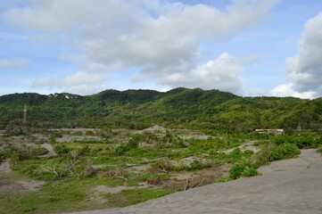 Yogyakarta, Indonesia – January 13, 2020:  Amazing landscape Indonesia, Gumuk pasir or sand dune in Bantul with beautiful blue sky. Selected Focus
