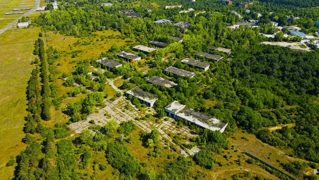 Aerial 4k drone footage of the village of Szentkirályszabadja in the Veszprém - Hungary. It is a former Soviet military base with barracks town sometimes referred to as the Hungarian Chernobyl.