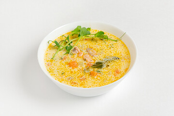 Creamy fish soup with salmon, potatoes, onions , carrots, dill and celery
