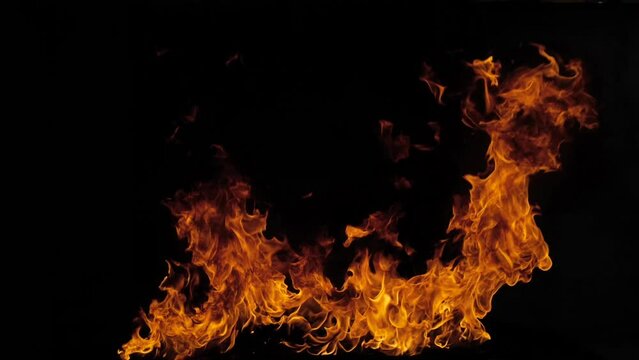 Fire on a black background. Abstract fire flame background, large burning fire. Slow motion.