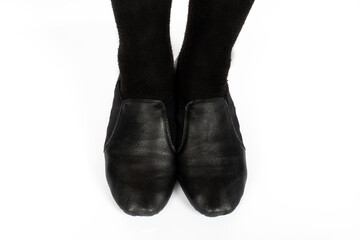 Black Jazz CORRECT standing feet position top down isolated on white background Close up of young female ballet dancer showing various classic ballet feet positions for jazz ballet