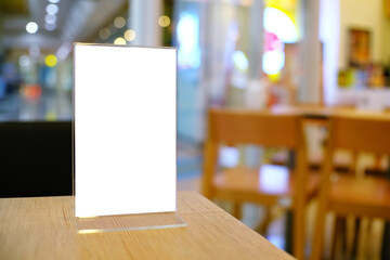 Menu frame standing on wood table in Bar restaurant cafe. space for text marketing promotion.