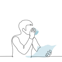man sits at a table with a newspaper in his hand and drinks from a mug - one line drawing vector. concept reading paper newspaper, breakfast