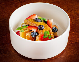 pancakes with fresh berries and sweet sauce