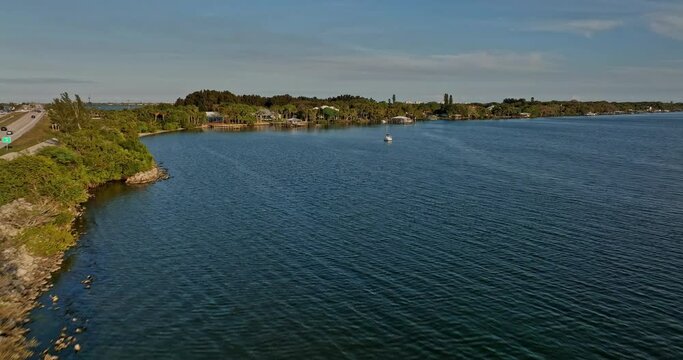 Merritt Island Florida Aerial v10 flyover Indian river capturing affluent residential neighborhood on the peninsula, luxury mansions with private dock slipway - Shot with Mavic 3 Cine - March 2022