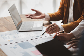 The sales department is having a monthly summary meeting to bring it to the department manager, they are verifying the correctness of the documents that are prepared before bringing in to the manager