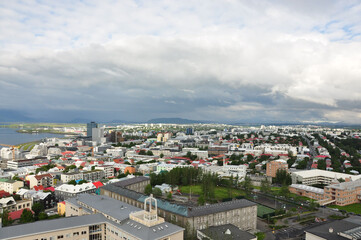 Aerial view of colorful buildings and lush greenery of Reykjavik, Iceland