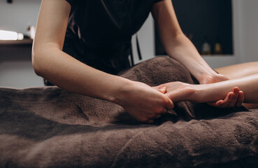 Fototapeta premium stroking massage of hands close up on a white background.