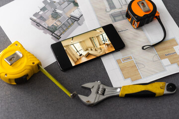 website wireframe sketch and programming code on smartphone