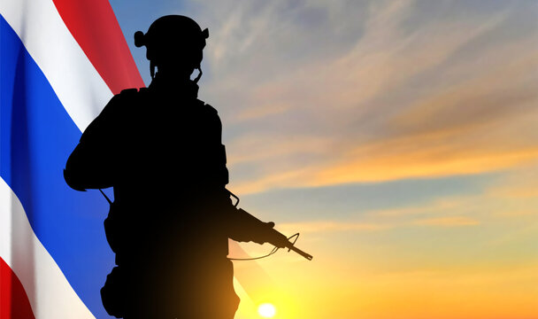 Silhouette of a soldier with Thai flag against the sunset. Patriotic concept. EPS10 vector