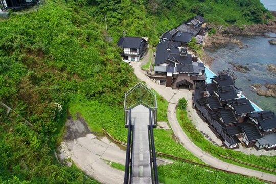 Thrilling wire-net pier with a view of the Lamp Inn and Suzu cape
