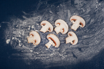 chopped mushrooms lie on a scattered vert