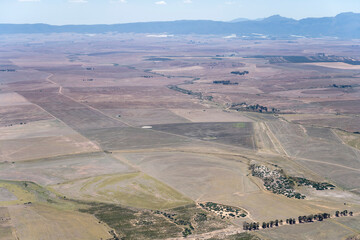 cultivated fields and farms in plains near Porterville aerial, South Africa